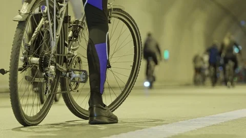 Cyclists in underground tunnel Stock Footage 69855503