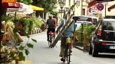 Cyclists using a pedestrian street legally Stock Footage 42139582