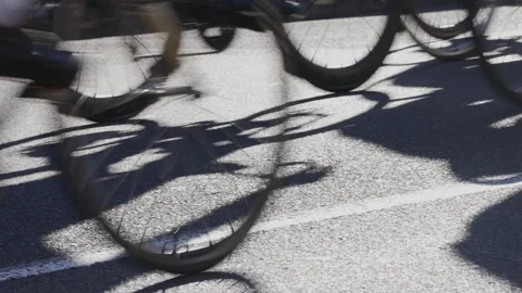 Cyclists very close up of wheels riding through frame, 4K 50p. Stock-Footage 162662070