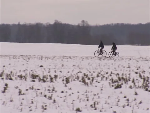 Cyclists in winter Stock Footage 2586685
