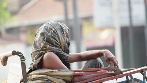 Cyclo Rickshaw Driver Protecting Head From Hot Sun Stock Footage 346014999