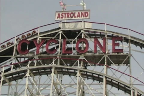 Cyclone with Roller Coaster going up and down Stock Footage 8540290