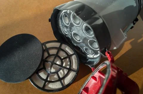 A cyclone vacuum cleaner container with replaceable air filters for collecting Foto stock