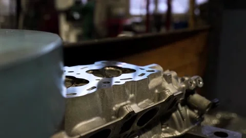 Cylinder Head Surface Grinding in Engine Repair Shop Stock Footage 308654140