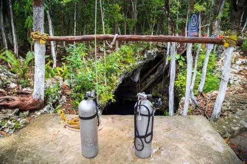 Cylinders for diving in the forest. Cave diving. Mexico Stock Photos