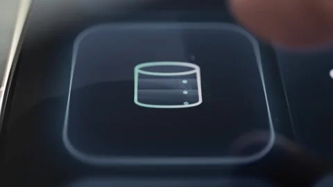 Cylindrical database icon selected on a modern technology investment dashboard Stock Footage 342489188