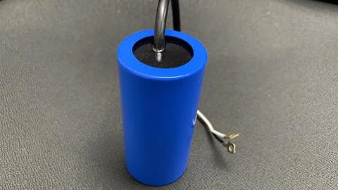 Cylindrical electrical capacitor with connection leads, Stock Photos