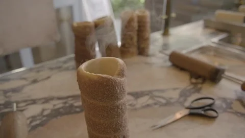Cylindrical Pastries Cooling on Marble Counter in Sydney Bakery Kitchen Stock Footage 345660078