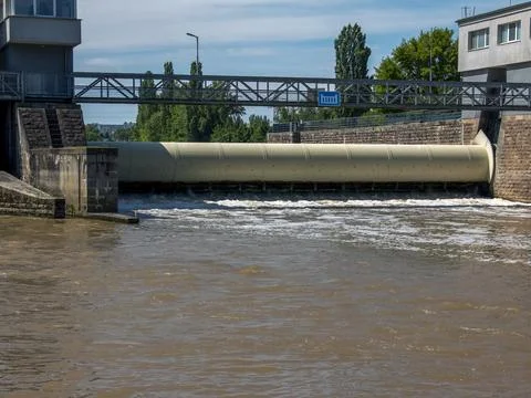 Cylindrical Weir Gate Controlling River Water Flow Stock Photos