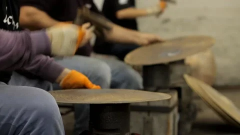 Cymbal Forge workers producing cymbals close up Stock Footage 237622167