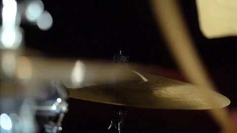 Cymbals in drum kit in frame and drummer playing performing with drumsticks. Video stock 240562363