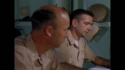 CYPRUS - 1960 - Two officers work in the USS Essex combat information center off Stock Footage 337710058