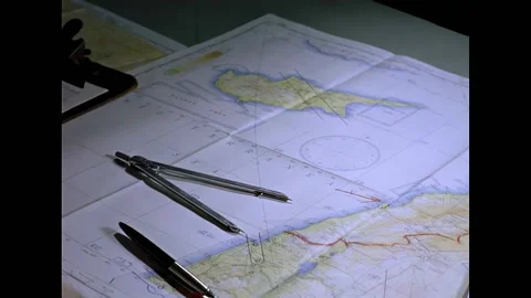 CYPRUS - 1960 - A worker plots coordinates on a map inside the USS Essex combat Stock Footage 337710037