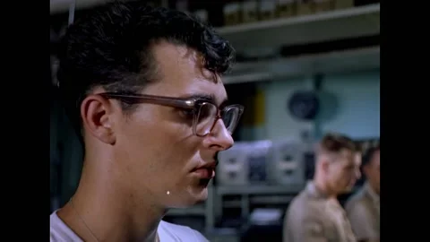 CYPRUS - 1960 - A worker plots coordinates on a map inside the USS Essex combat Stock Footage 337710045