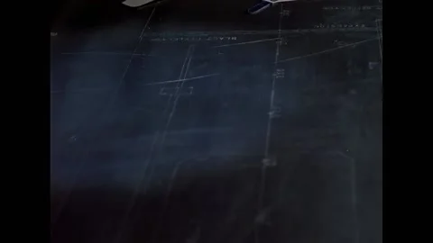 CYPRUS - 1960 - A worker views coordinates on a plastic board, and workers move Stock Footage 337710066