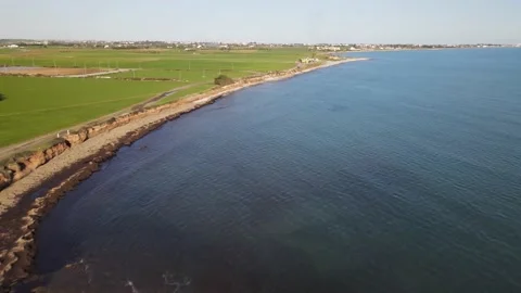 Cyprus green fields. Sea and waves. Fly over beautiful views near Larnaca. Видео 167973302