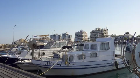 CYPRUS, LARNACA - CIRCA May 2019: City pier with fishing boats. Parking of boats 스톡 동영상 109449314