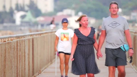 Cyprus, Larnaca, September 06, 2019. People walk across the bridge on summer Stock Footage 138997430