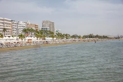 Cyprus, Larnaca at summer. Seafront multi-storey buildings, sandy beach, blue Stock Photos