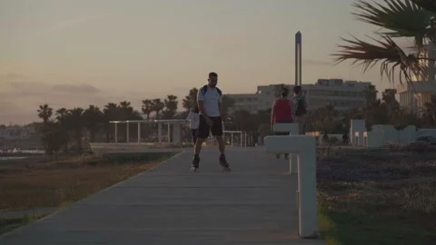 Cyprus. Pathos. May 15, 2021. Evening promenade with palm trees and a promenade Stock Footage 170522412