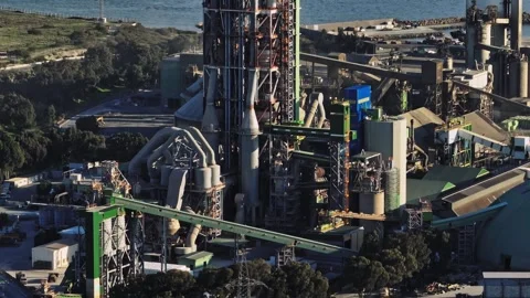 Cyprus power plant aerial view: fuel tanks, chimneys emitting smoke Stock Footage 307072353