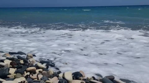 Cyprus. A rocky beach is washed by waves. Stock Footage 311573761