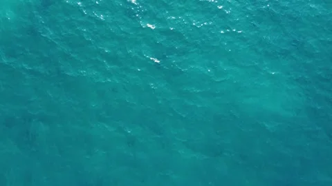 Cyprus. Turquoise and deep blue ocean water surface reflecting sun rays. Top Stock Footage 346100790