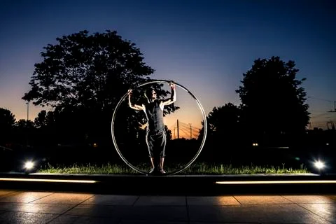 Cyr wheel performance session at night in Riga. Stock-Fotos