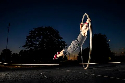 Cyr wheel performance session at night in Riga. Stock-Fotos