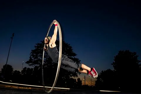Cyr wheel performance session at night in Riga. Stock-Fotos