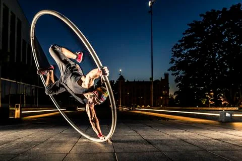Cyr wheel performance session at night in Riga. Stock-Fotos