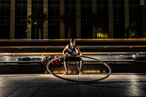 Cyr wheel performance session at night in Riga. Stock Photos