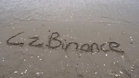 Cz Binance is written in the sand, Wave Deletes Cz Binance Text Video stock 160911923