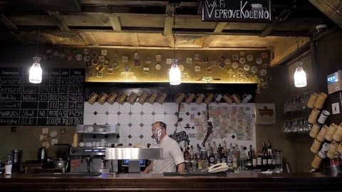 Czech beer bar. Behind the bar the bartender Stock Footage 124314101