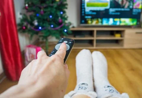 Czech Changing channels and looking for a movie to watch - SHOTLISTstream Stock Photos