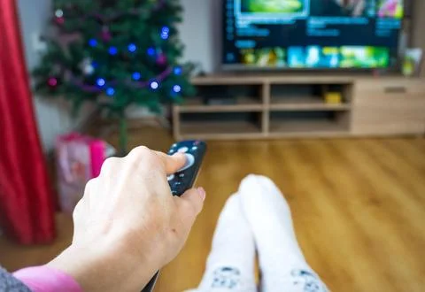 Czech Changing channels and looking for a movie to watch - SHOTLISTstream Stock Photos