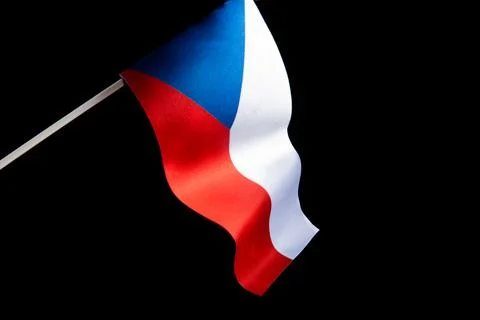 The Czech flag on a black background is developing and flying in the wind. Czech Stock Photos