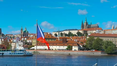 Czech flag waving in prague with view of prague castle Stock Footage 329582390