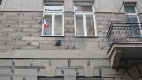 Czech flag waving on a praguese facade with snow flakes Stock Footage 147927645