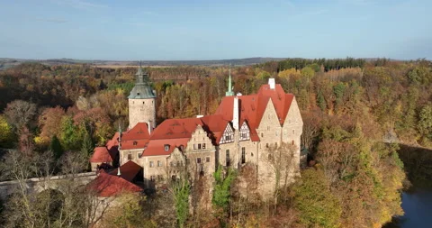 Czocha Castle aerial pullback revealing bridge and river in autumn Stock Footage 346661326