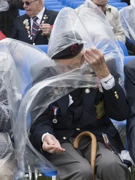 D-day Veteran Battle With The Elements While Attending A Commemoration Service F Stock Photos