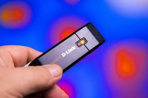 D-link usb wireless adapter with signal indicator in hand Stock Photos