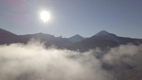 [D-LOG] 4K Snowy Mountain Over Clouds Stock Footage 114632579