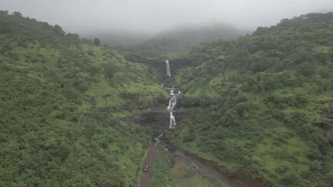 D log aerial drone shot of Beautiful waterfall in rainy season Stock Footage 156893199