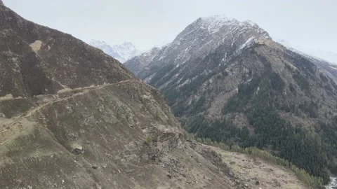 D log aerial view drone shot sliding shot of mountain in himalayan mountain Stock Footage 157628262