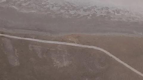 D-Log M. Aksaray, Turkey. Tuz Golu salt lake shore, a winding road tracing the Stock Footage 339765566