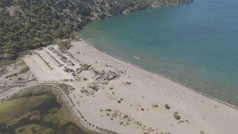 D-Log M. Dalyan, Turkey. Aerial drone view of Iztuzu Beach with sun loungers, Stock Footage 324167491