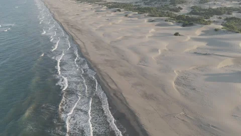D-Log M. Gelemis, Turkey. Close aerial view of white foam waves on Patara Beach Stock Footage 320859839