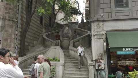 D-Log M. Istanbul, Turkey. Tourists photographing Camondo Stairs from bottom, Stock Footage 332974683