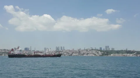 D-Log M. Istanbul, Turkey. Black cargo vessel with white superstructure and red Stock Footage 339764615